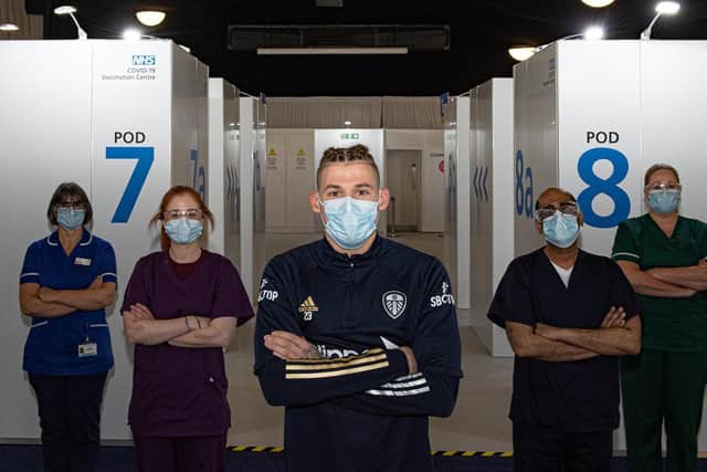 Leeds United's Kalvin Phillips pictured with NHS staff at the vaccination centre at Elland Road