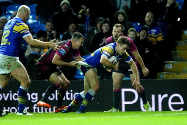 Leeds Rhinos' Jimmy Keinhorst breaks free from Hull KR's Danny McGuire to score his hat-trick try. Picture: Jonathan Gawthorpe.