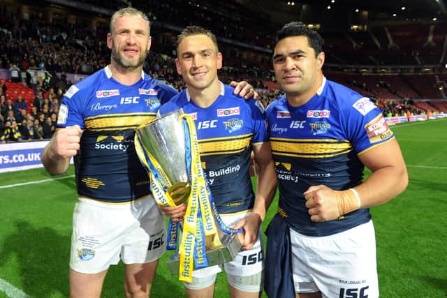 Leeds Rhinos retiring stars Jamie Peacock, Kevin Sinfield and Kylie Leuluai with Grand Final trophy in 2015. Picture: Steve Riding.