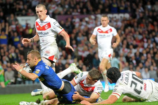 Rob Burrow scores for Rhinos in the 2011 Grand Final. Picture by Bruce Rollinson.