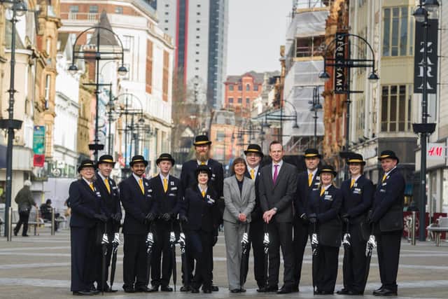LeedsBID chief executive Andrew Cooper, fifth from right, pictured in 2016 with ambassadors hired to welcome visitors to the city centre. Picture: James Hardisty