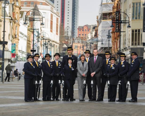LeedsBID chief executive Andrew Cooper, fifth from right, pictured in 2016 with ambassadors hired to welcome visitors to the city centre. Picture: James Hardisty