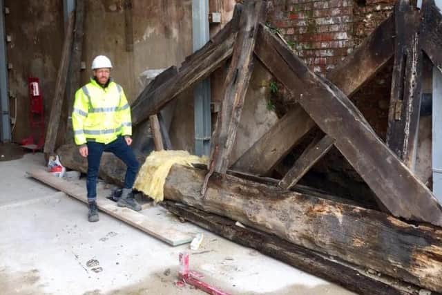 Thousand-year-old timber has been found inside.