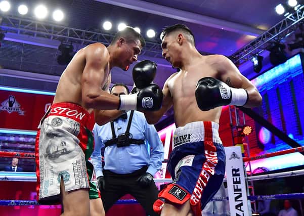 THREAT: Mauricio Lara, right, in action against Alejandro Palmero in Mexico City in July last year. Picture: Jaime Lopez/Jam Media for Zanfer/Getty Images.