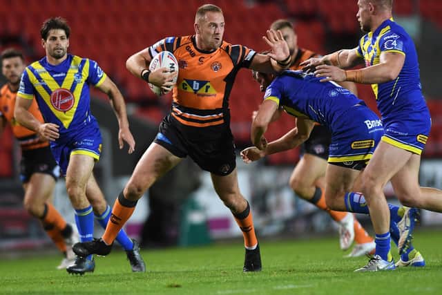 Liam Watts on the attack for Tigers against Warrington last September. Picture by Jonathan Gawthorpe.