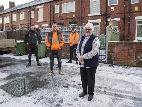 Oli Farmer, Max Field, and Kyle Stanhope from  Millennium scaffolding and roofing with Woodlesford pensioner Margaret Johnson. 
They waived their fee for roof repair work at her terraced home.
Mrs Johnson is suffering from bowel cancer and is undergoing weekly chemotherapy treatment at S James's Hospital in Leeds. 

Picture: Tony Johnson