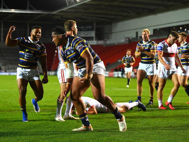 Ava Seumanufagai, with ball, celebrates scoring for Rhinos in last year's Cup win over Hull KR. Picture by Jonathan Gawthorpe.