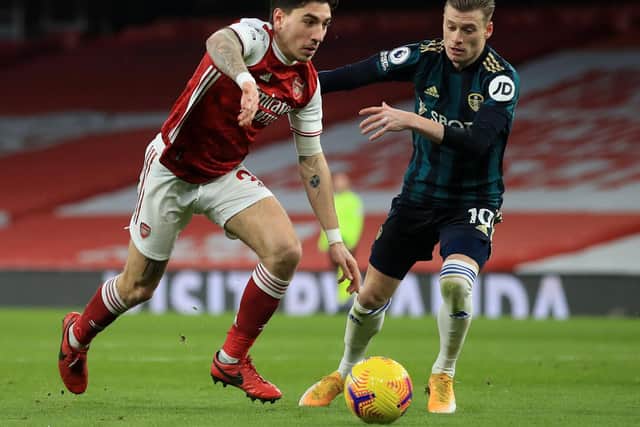 WHITES FRIGHT: Hector Bellerin, left, beats Gjanni Alioski before scoring Arsenal's third in Sunday's clash at the Emirates in which Leeds United came back from 4-0 down to reduce the deficit to 4-2. Photo by Adam Davy - Pool/Getty Images.