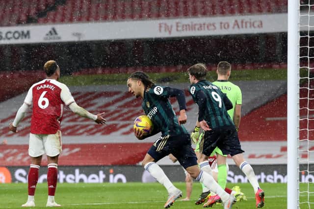 'PILING FORWARD': Helder Costa quickly grabs the ball and races back to the centre circle after netting Leeds United's second goal in Sunday's 4-2 defeat at Arsenal. Photo by Catherine Ivill/Getty Images.