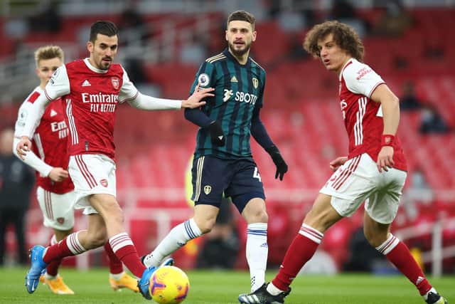 BATTLING ON: Leeds United's Polish international midfielder Mateusz Klich, centre, during the first half of Sunday's 4-2 Premier League loss against Arsenal at the Emirates. Photo by Julian Finney/Getty Images.