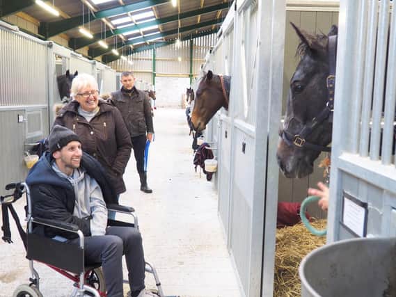Rob Burrow meets thre year old racehorse Burrow Seven - pictured with his mother Irene (Photo: Burrow Seven Racing Club / SWNS)