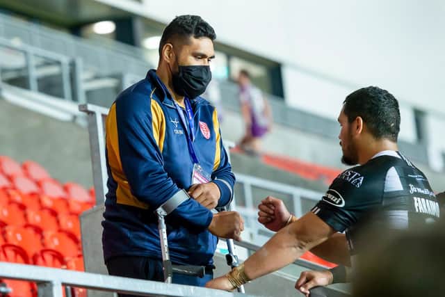 Hull KR's Mose Masoe with Hull FC's Bureta Faraimo at Totally Wicked Stadium in October. Super League Round Two will be held there in his honour this year. (ALLAN MCKENZIE/SWPIX)