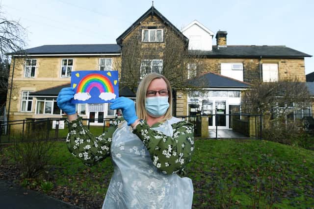 odie Boucher with a best wishes card at Carr Croft Care Home in Meanwood, Leeds. Picture: Jonathan Gawthorpe