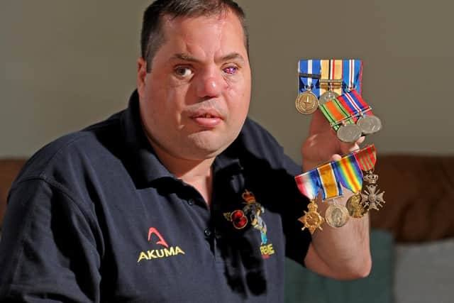 Simon Brown pictured with his own medals and those of his grandfather and great-grandfather who fought in both the World Wars in November 2019. Picture Tony Johnson.