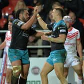 HIGH FIVE: Ash Handley celebrates with Konrad Hurrell after scoring the Rhinos' third try against St Helens on this day in 2019. Picture: Bruce Rollinson.