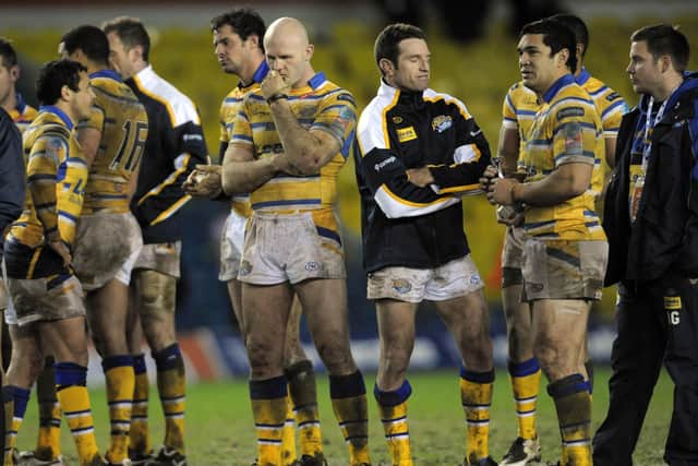 EDGED OUT: Leeds Rhinos players show their disappointment after losing to Melbourne Storm in 2010. Picture: Mark Bickerdike.