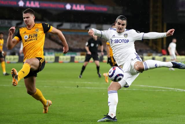 LETTING FLY: Leeds United's Pascal Struijk (right) attempts a shot on goal at Wolves. Picture: Nick Potts/PA Wire.
