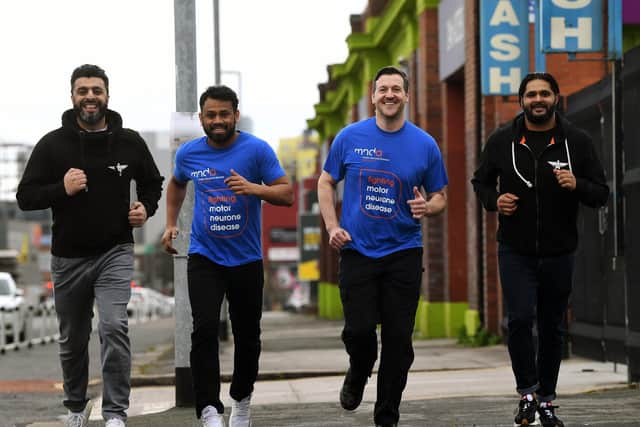 Members of the Akhirah Team, a humanitarian charity in Leeds which has organised a '7 for 7' running challenge for MND and Rob Burrow. From left, Aihtsham Rashid, Kabir Miah, Sgt Mark Rothery and Mo Ali. Picture: James Hardisty