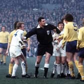 Bill Hirst took this photograph at Elland Road on March 18 1972 of referee Jack Taylor stepping in between  Billy Bremner and Tottenham Hotspur players during a sixth round  F A Cup tie, which Leeds won 2-1.