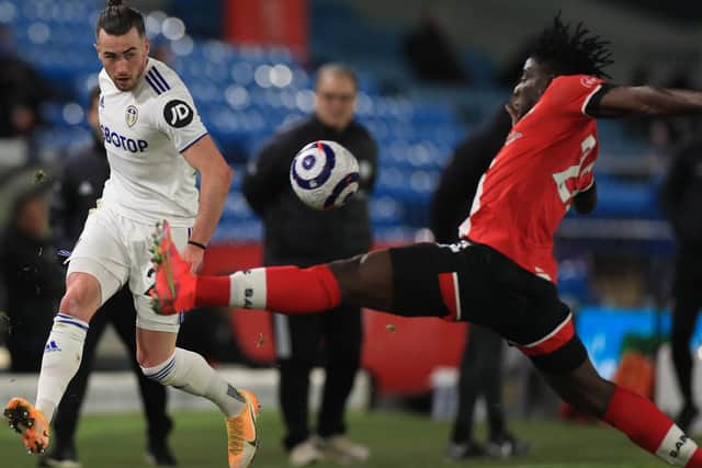 PRAISE: For Leeds United winger Jack Harrison, left, as Whites head coach Marcelo Bielsa, background, looks on during Tuesday evening's 3-0 win at home to Southampton. Photo by MIKE EGERTON/POOL/AFP via Getty Images.