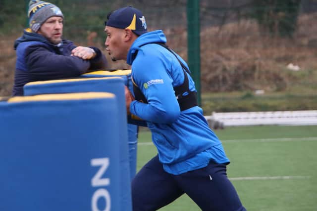 Assistant-coach Sean Long looks on as Zane Tetevano gets stuck into pre-season training. Picture by Phil Daly/Leeds Rhinos.