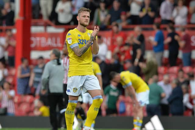 HEARTACHE: Whites captain Liam Cooper applauds the travelling Leeds United supporters following the 2-0 defeat at Brentford of Easter Monday 2019. But Leeds romped to promotion as champions one year on. Picture by Bruce Rollinson.
