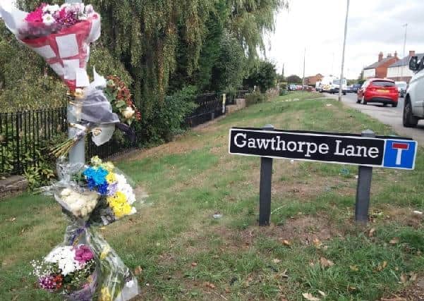Floral tributes following death of 21-year-old Ali Ahmed in fatal crash in Kirkhamgate in September 2018.