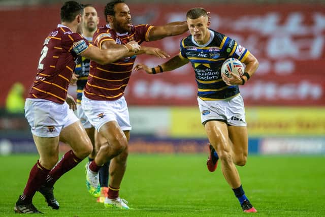 Ash Handley in action against Huddersfield last year. he has been training at full-back for Rhinos. as well as on the wing. Picture by Bruce Rollinson.