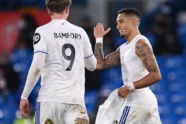 PUT IT THERE! Leeds United duo Raphinha, right, and Patrick Bamford, left, after Raphinha's free-kick scored in last month's 3-0 win at home to Southampton. Photo by Laurence Griffiths/Getty Images.