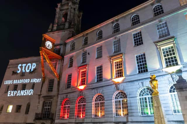 An anti-airport expansion message projected onto Leeds Civic Hall.