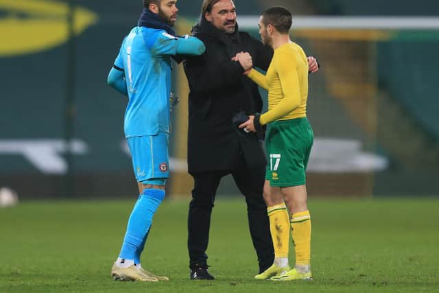 FLYING: Norwich City boss Daniel Farke with David Raya, left, and Emi Buendia, right, after Wednesday night's 2-0 victory at home to second-placed Brentford which put his leaders ten points clear. Photo by Stephen Pond/Getty Images.