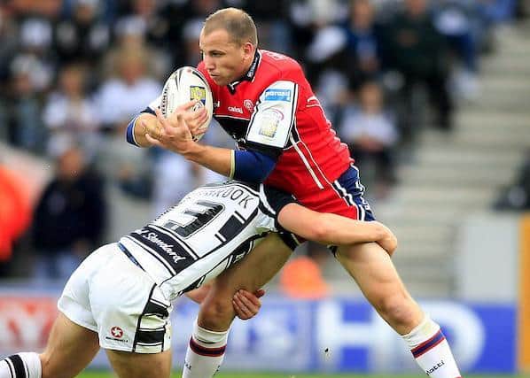 Then playing for Hull KR, Morgan's father Jim Gannon is tackled by Danny Washbrook in a 2007 Hull derby. Picture by Chris Mangnall/SWpix.com,