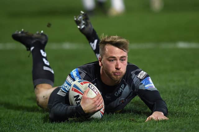 Danny Richardson scores for Tigers in last year's win at Hull KR. Picture by Jonathan Gawthorpe.