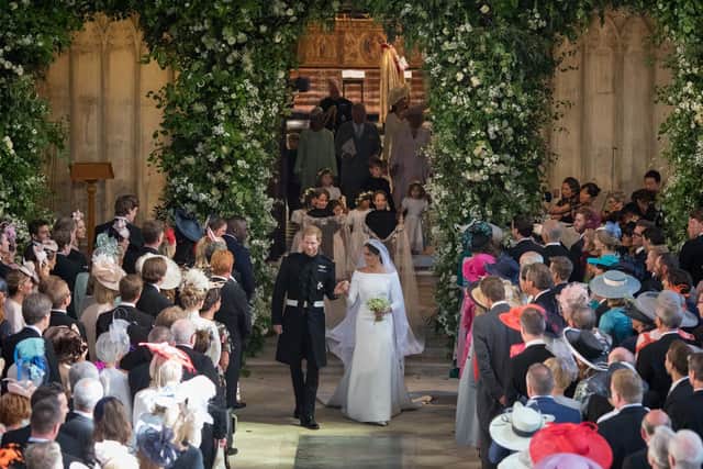 File photo dated 19/05/18 of Prince Harry and Meghan Markle, now the Duke and Duchess of Sussex, leaving St George's Chapel at Windsor Castle after their wedding. As the bitter fallout from Megxit worsens, the monarchy's troubles have been labelled the War of the Waleses 2.0.
PA/PA Wire