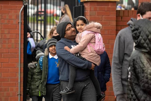 All smiles for parents and pupils as kids headed back to the classroom.