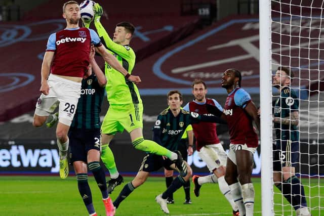 THREAT: West Ham bombard Leeds United with another set piece in Monday night's clash at the London Stadium as 'keeper Illan Meslier collects under pressure from Tomas Soucek. Photo by IAN WALTON/POOL/AFP via Getty Images.