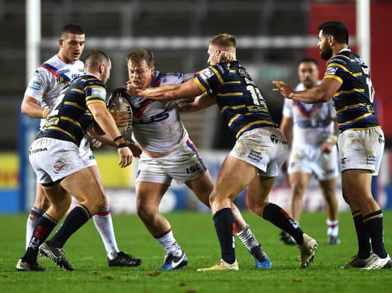 Eddie Battye, pictured on the attack against Leeds Rhinos, has a calf strain and is unlikely to feature this weekend. Picture by Jonathan Gawthorpe.