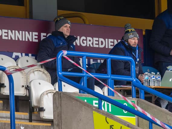 Coach Richard Agar, left, watches Rhinos in action at Huddersfield, alongside assistant Sean Long. Picture by Tony Johnson.