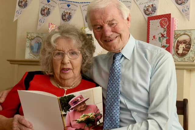Ken and Margery Aveyard with the card the Queen  has sent congratulating them on their 65th wedding anniversary.

Photo: Gary Longbottom.