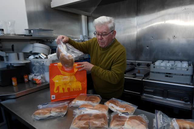 Mr McLoughlin in the Irish Centre kitchens helping to prepare the sandwiches being made up for homeless people in Leeds.