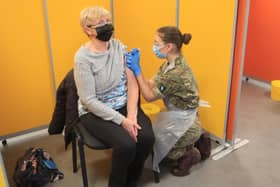 A vaccine is administered in Wakefield. Pic by PA