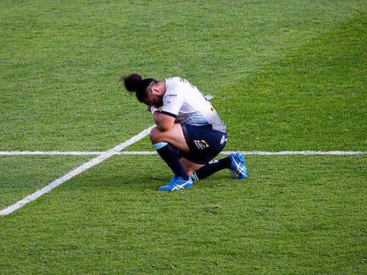 Leeds Rhinos' Konrad Hurrell takes a knee before a Super League game last season. Picture by Alex Whitehead/SWpix.com