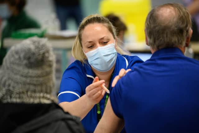 A person being vaccinated (photo: PA).