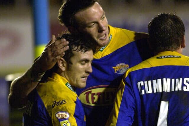 Wayne McDonald congratulates Ryan Sheridan after his try in the first half against Warrington in 2002. Picture: Steve Riding.