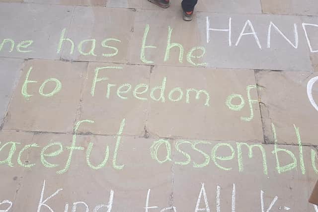 "Everybody has the right to freedom of peaceful assembly" written on the floor outside Leeds Civic Hall.