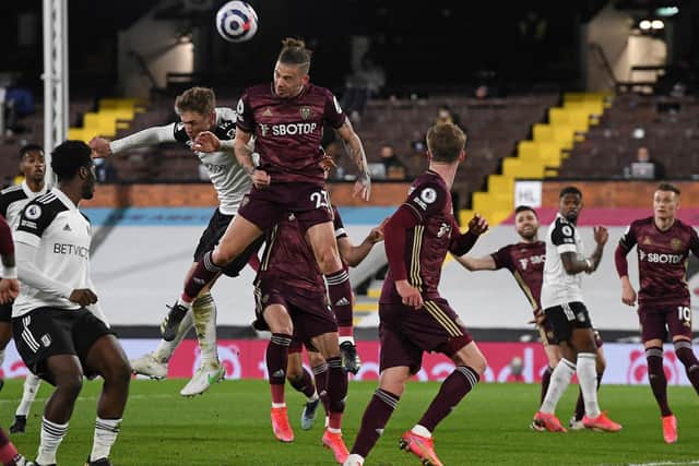 FLYING HIGH: Leeds United midfielder Kalvin Phillips clears one of Fulham's 13 corners in Friday night's 2-1 victory at Craven Cottage. Photo by ANDY RAIN/POOL/AFP via Getty Images.