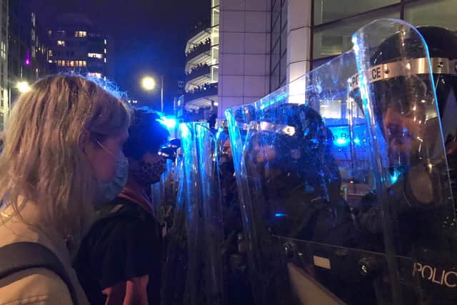 Protesters and riot police in Bristol. Photo: SWNS