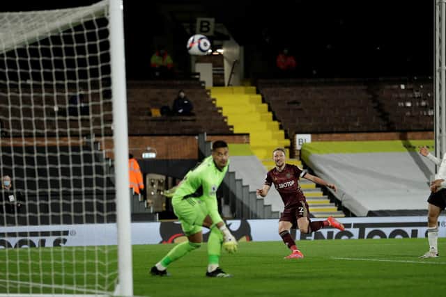 FALSE HOPE: For Leeds United defender Luke Ayling who thought he had scored his first Premier League goal with his fine header against Fulham, above, in Friday's clash at Craven Cottage. Photo by MATT DUNHAM/POOL/AFP via Getty Images.