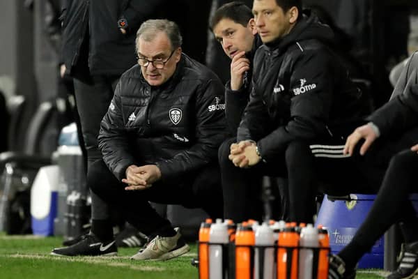 CAUTION: From Leeds United head coach Marcelo Bielsa, left, pictured during Friday night's 2-1 victory at Fulham which put the Whites on to 39 points for the Premier League campaign. Photo by MATT DUNHAM/POOL/AFP via Getty Images.
