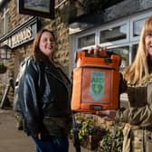 Louisa Pouncett, WF3 Kindness Volunteer, and Camille Leach, secretary for West Ardsley Action Group with the defibrillator at the Hare and Hounds in West Ardsley. Picture: Bruce Rollinson